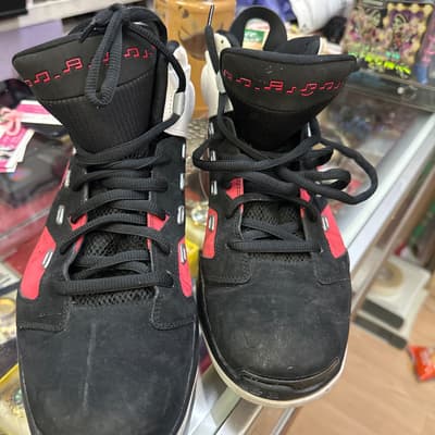 Black High-Top Sneakers with Red Music Note Detail