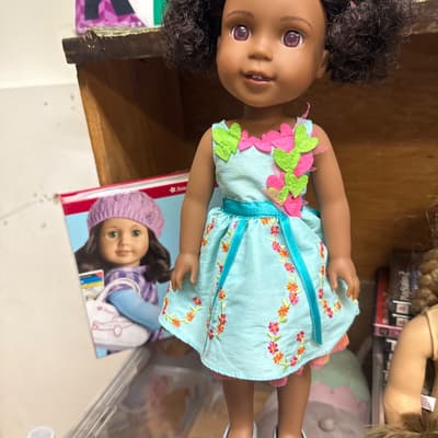 Curly-Haired Doll in Turquoise Floral Dress